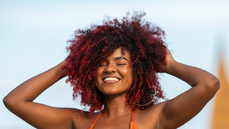 Woman with curly red hair