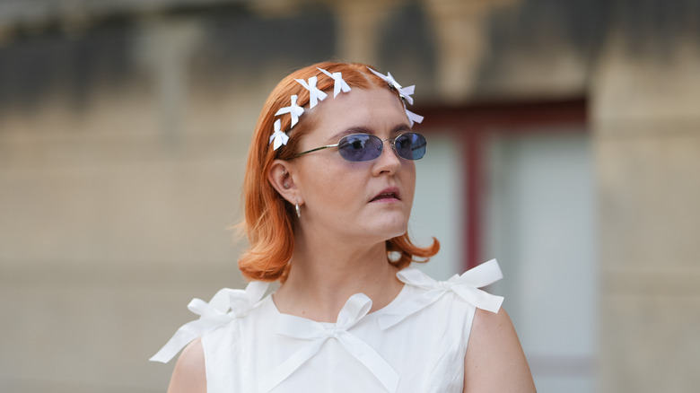 Woman with white bows in her hair