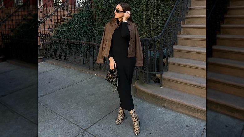 A woman wearing snakeskin boots