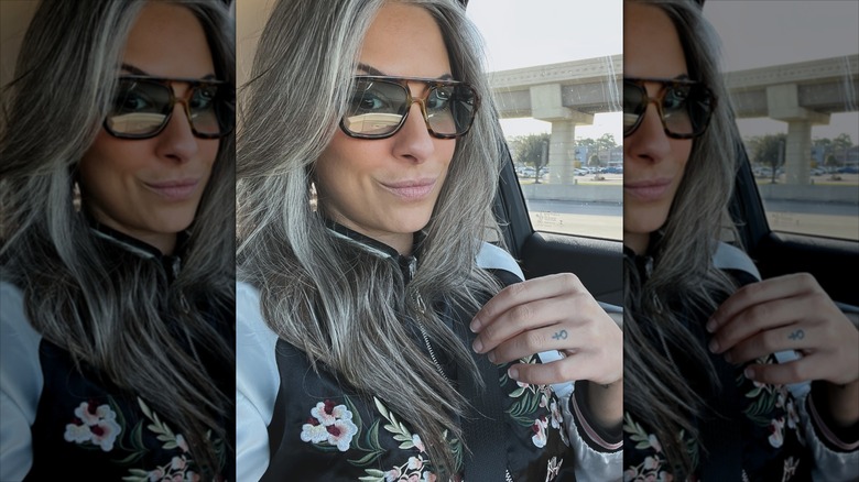 A woman with long hair and long bangs