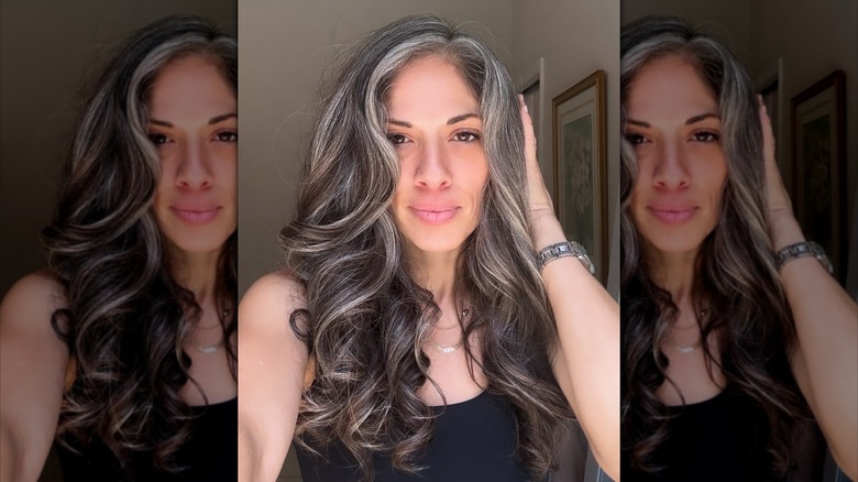 A woman with long, layered hair