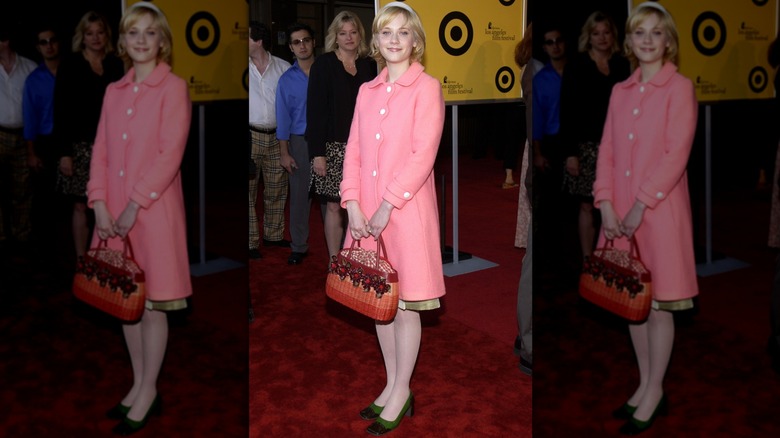 Zooey Deschanel wearing a pink coat at the 2002 premiere of "The Good Girl"