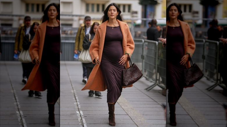 A woman in a purple dress with brown suede boots