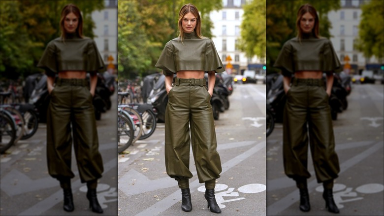 A woman in olive green wearing ankle boots