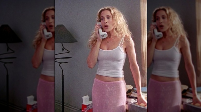 Carrie Bradshaw in white tank and pink skirt