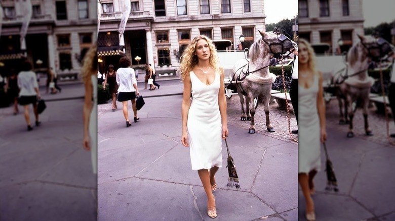 Carrie Bradshaw wears white slip dress outside the plaza