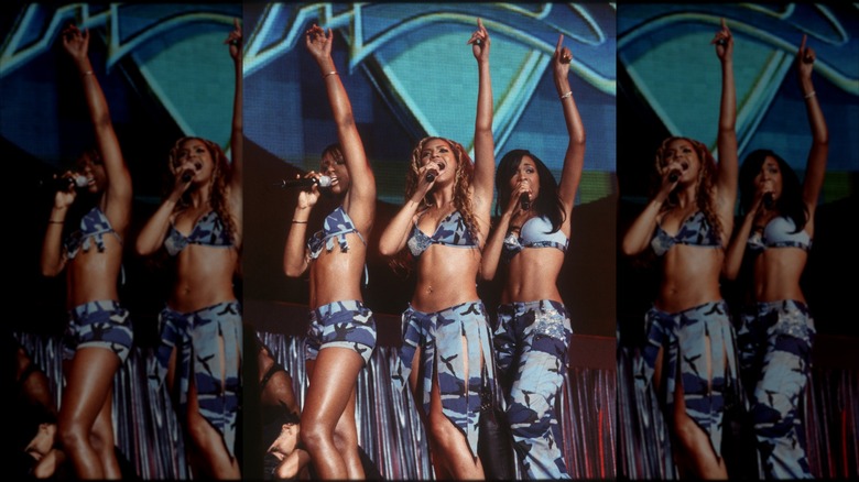 Destiny's Child perform wearing blue camo outfits.