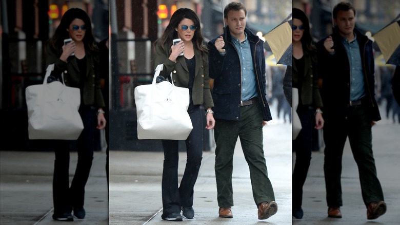 Lauren Graham walking in the rain