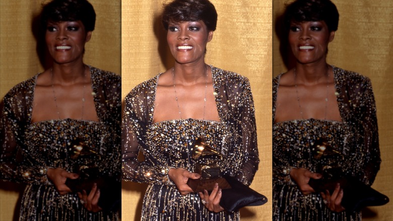 Dionne Warwick smiles in an embellished dress