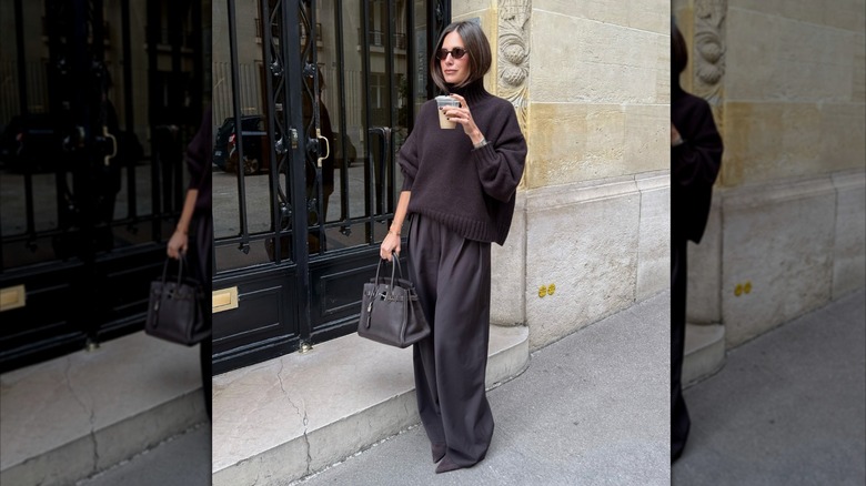 Woman wearing baggy turtleneck and pants