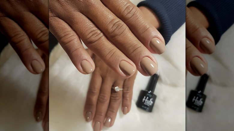 A woman with light brown nails on Instagram