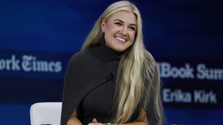 Erika Kirk in a grey cape dress on stage in New York City