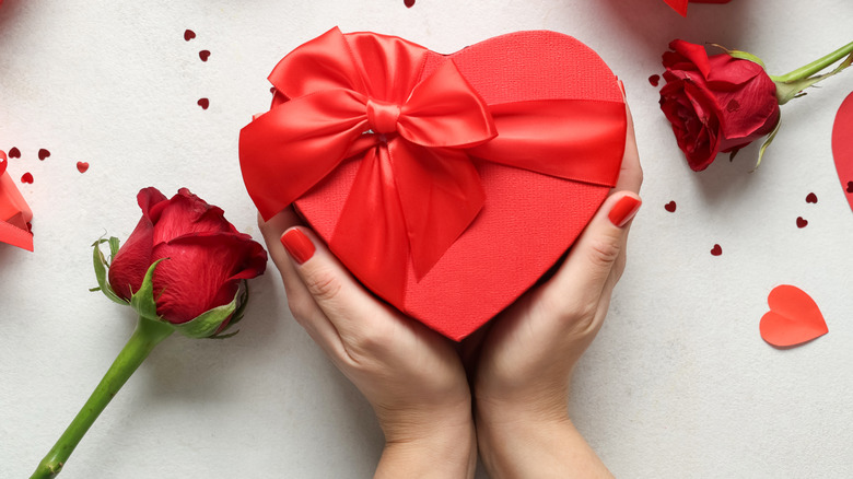 Woman holding a box of chocolates