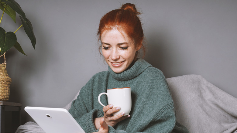 Woman reading a Kindle