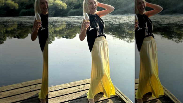A woman in an ombre yellow skirt