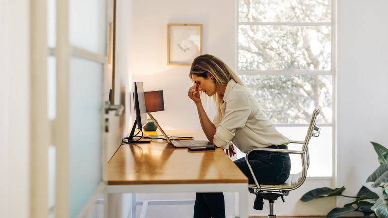 stressed woman at desk