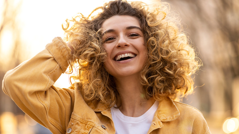 blond women smiling in sun