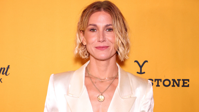 Jen Landon smiles on the red carpet in 2022