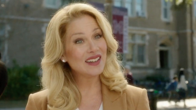 Christina Appleton smiles with curly blond hair