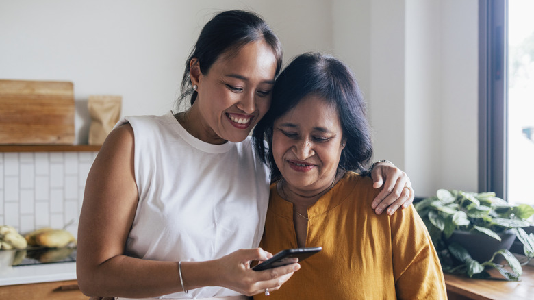 Two women looking at phone