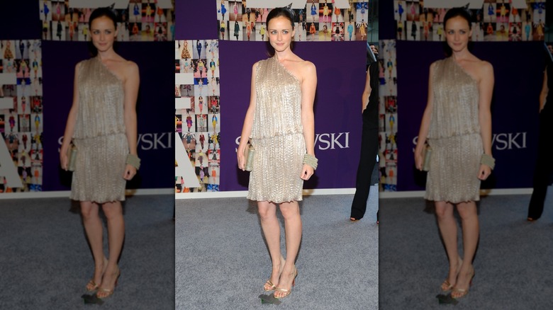 Alexis Bledel on the red carpet in a gold mini dress