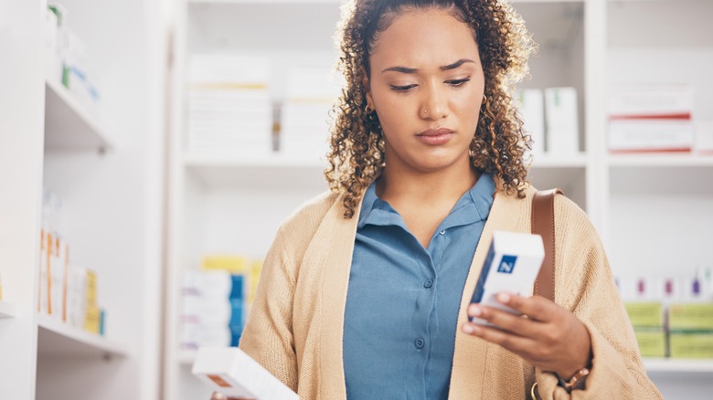 woman reading product labels