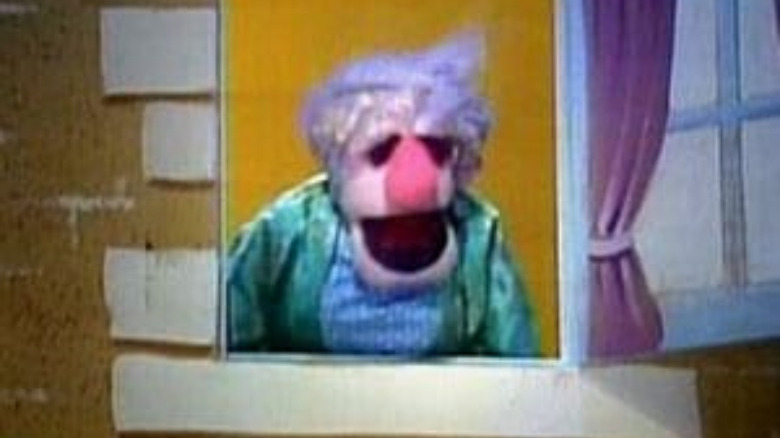 lady muppet in window