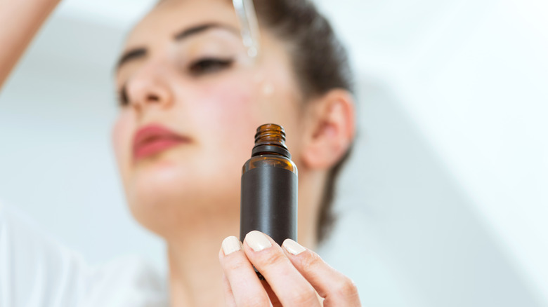 'Woman with facial serum