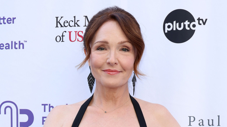 Amy Yasbeck smiles on the red carpet in 2025