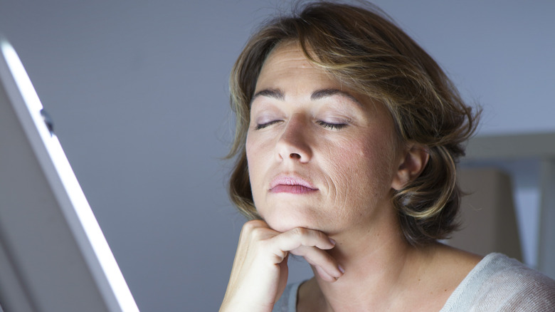 woman with sad lamp