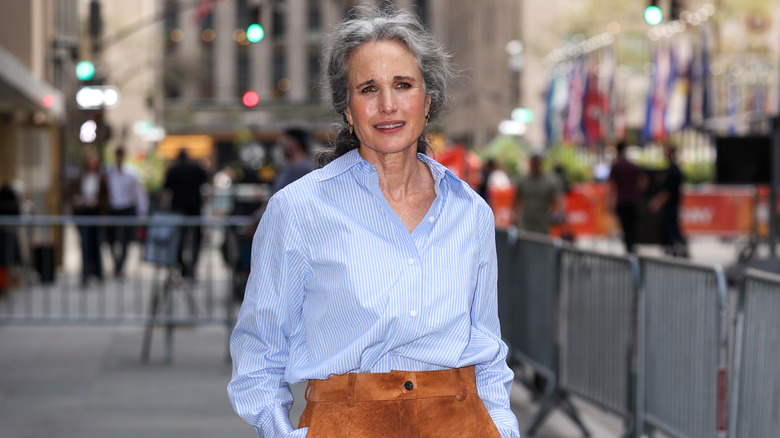Andie MacDowell smiles while out on the street in 2026