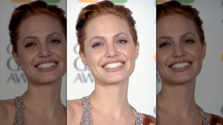 Angelina Jolie smiling on the 1999 Golden Globe Awards