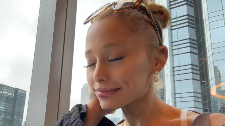 Ariana Grande with her eyes closed without makeup