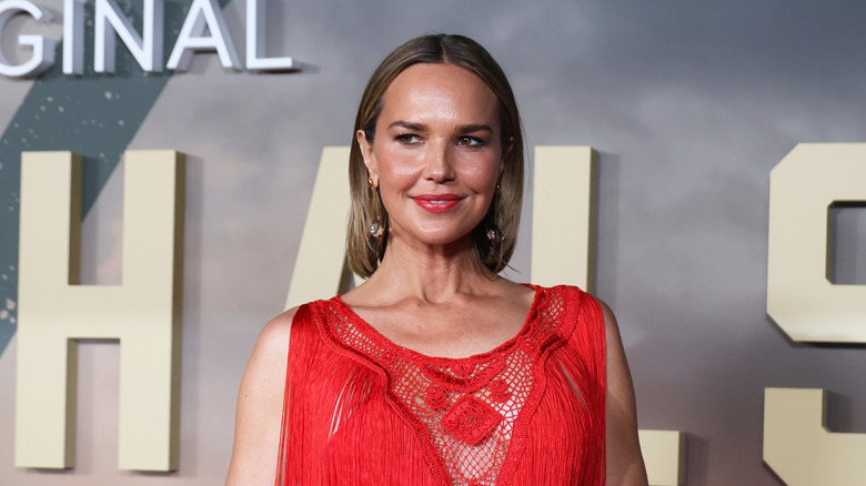Arielle Kebbel wearing a bright red dress at the Los Angeles premiere of CBS Original's "Marshals" at Autry Museum of the American West in 2026