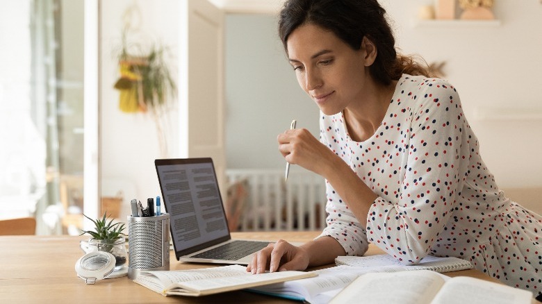 Woman reading and researching online