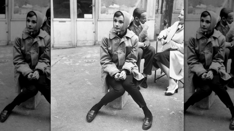 Audrey Hepburn sitting on the set of "Funny Face"