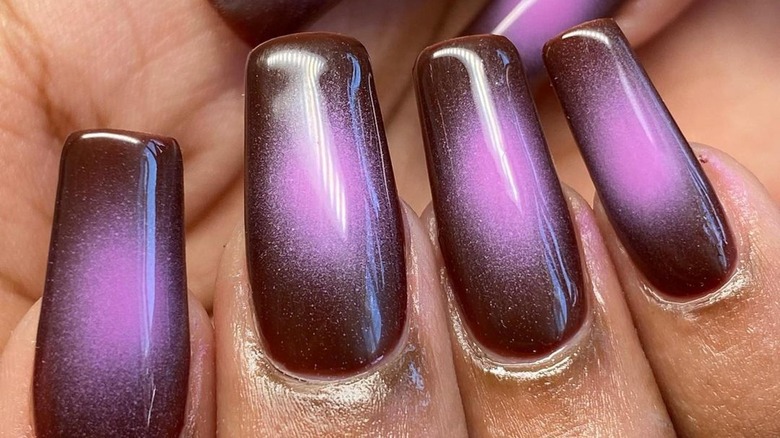 close-up of black and purple aura nails
