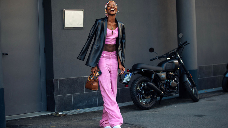 woman in pink wide-leg jeans