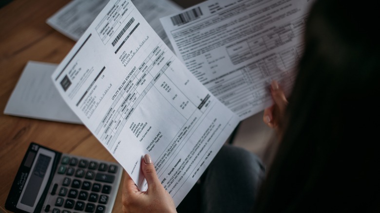 Woman looking over bills