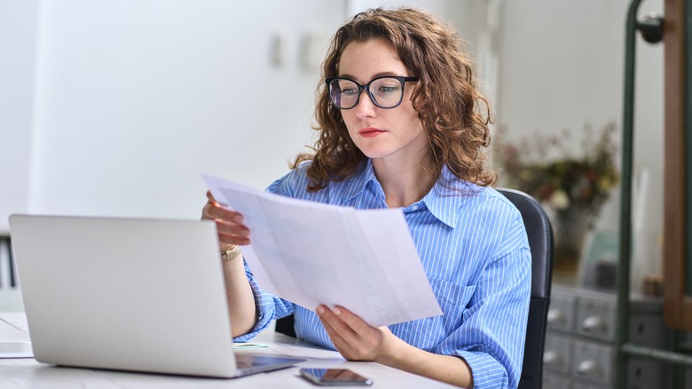 Woman looking at statements