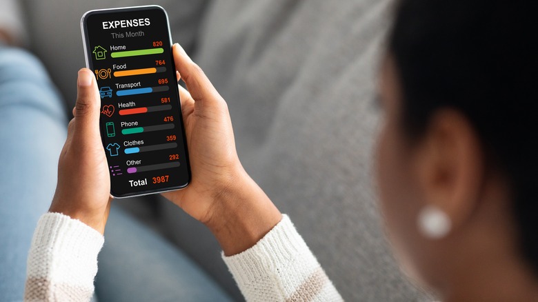 Woman using mobile finance tracker