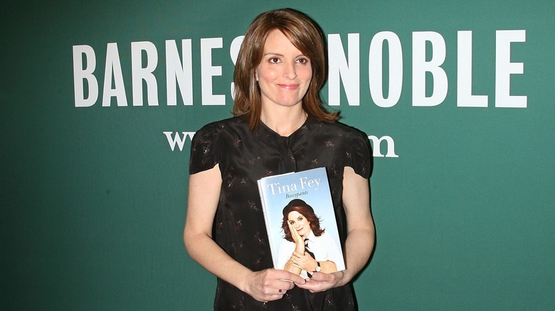 Tina Fey with her book