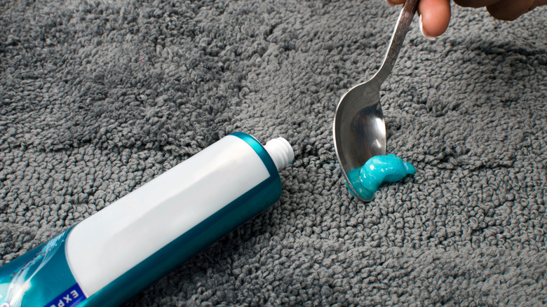 Scraping toothpaste off carpet