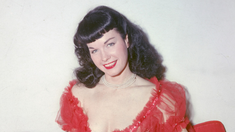 Bettie Page posing