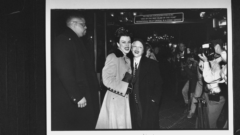 An undated black-and-white photograph of Debi Mazar and Madonna