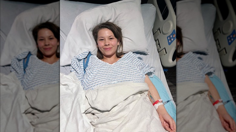 Bindi Irwin laying in a hospital bed