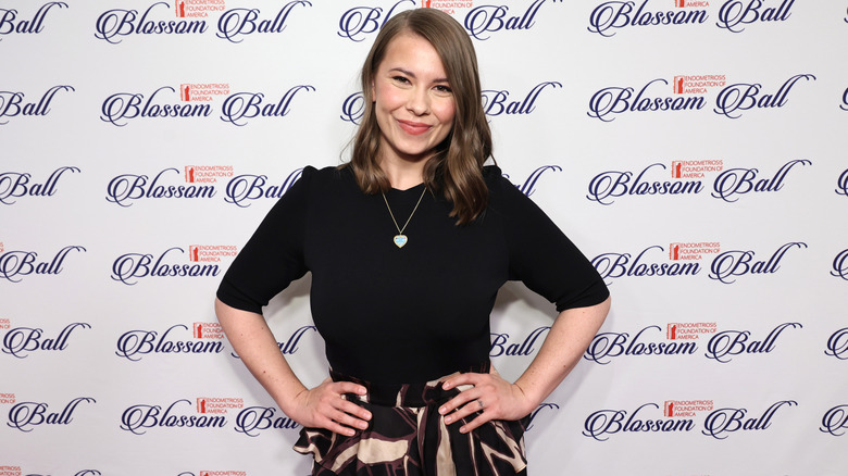 Bindi Irwin posing with her hands on her hips at a 2024 event