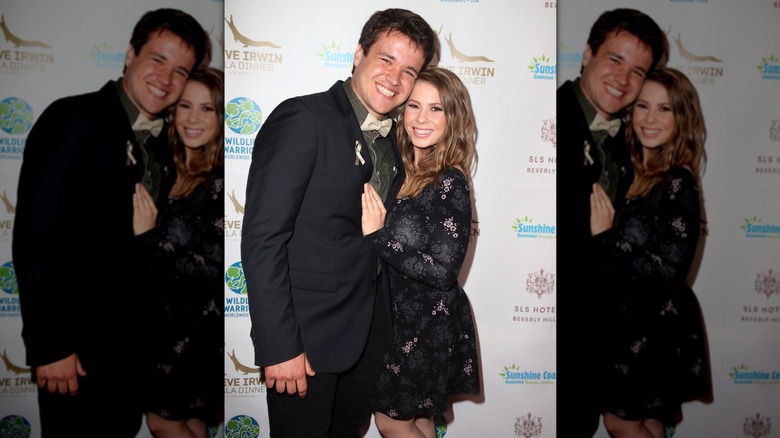 Bindi Irwin and Chandler Powell on the red carpet wearing black