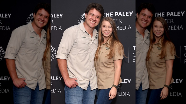 Bindi Irwin and Chandler Powell on the red carpet in tan shirts