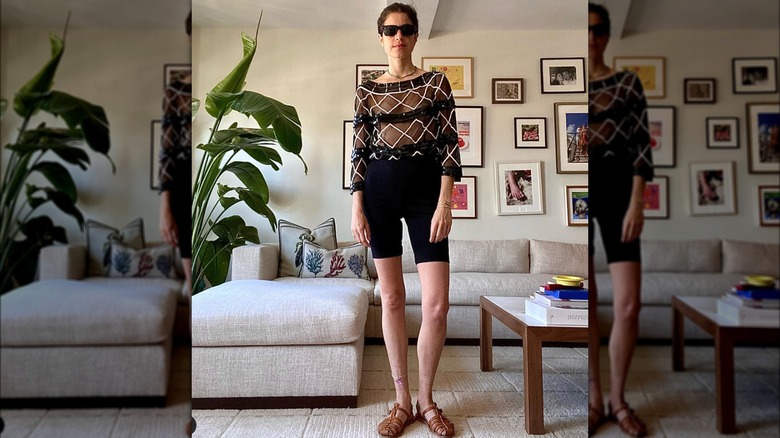 Woman at home in all black outfit